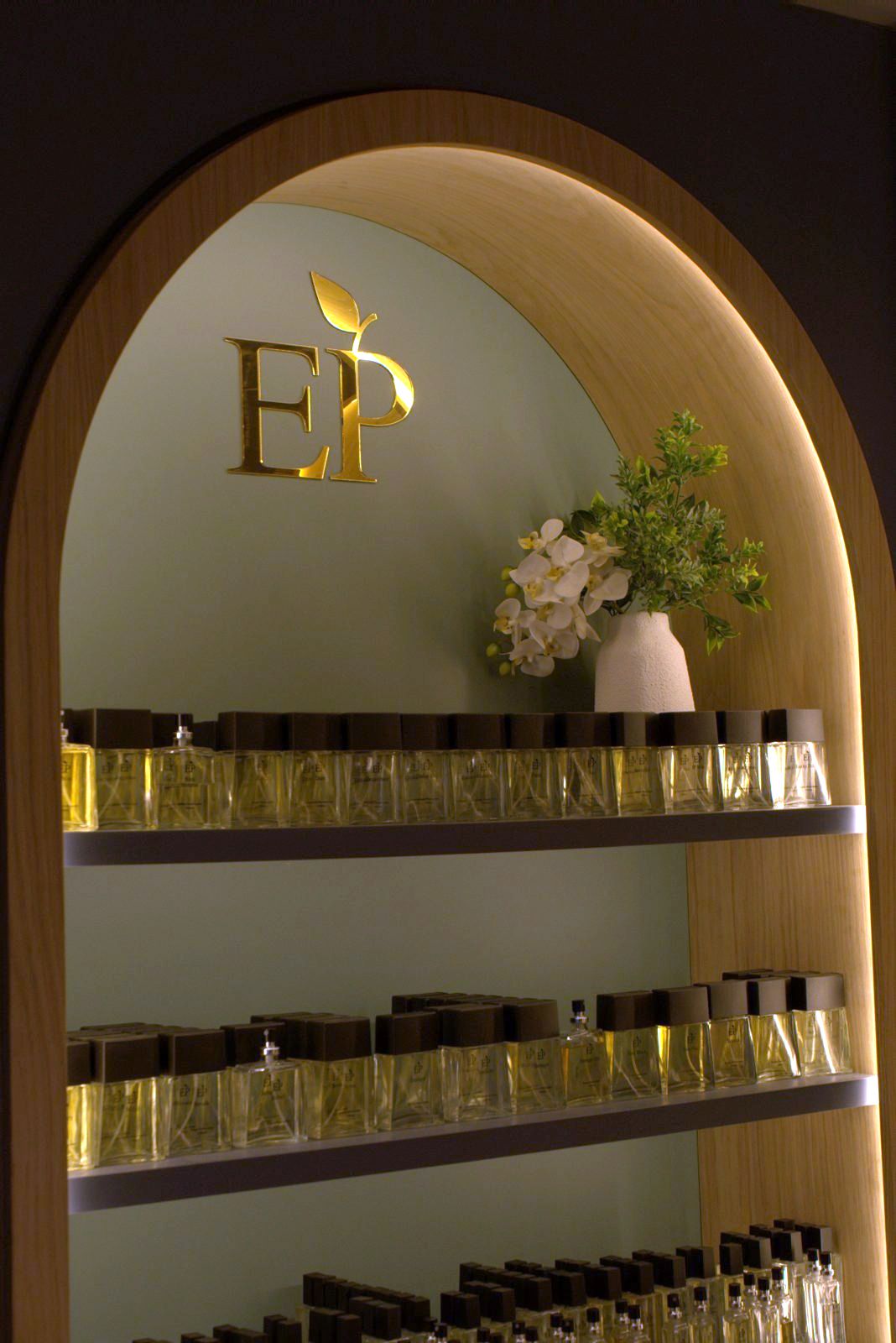 Lit oak arch with the gold EP monogram