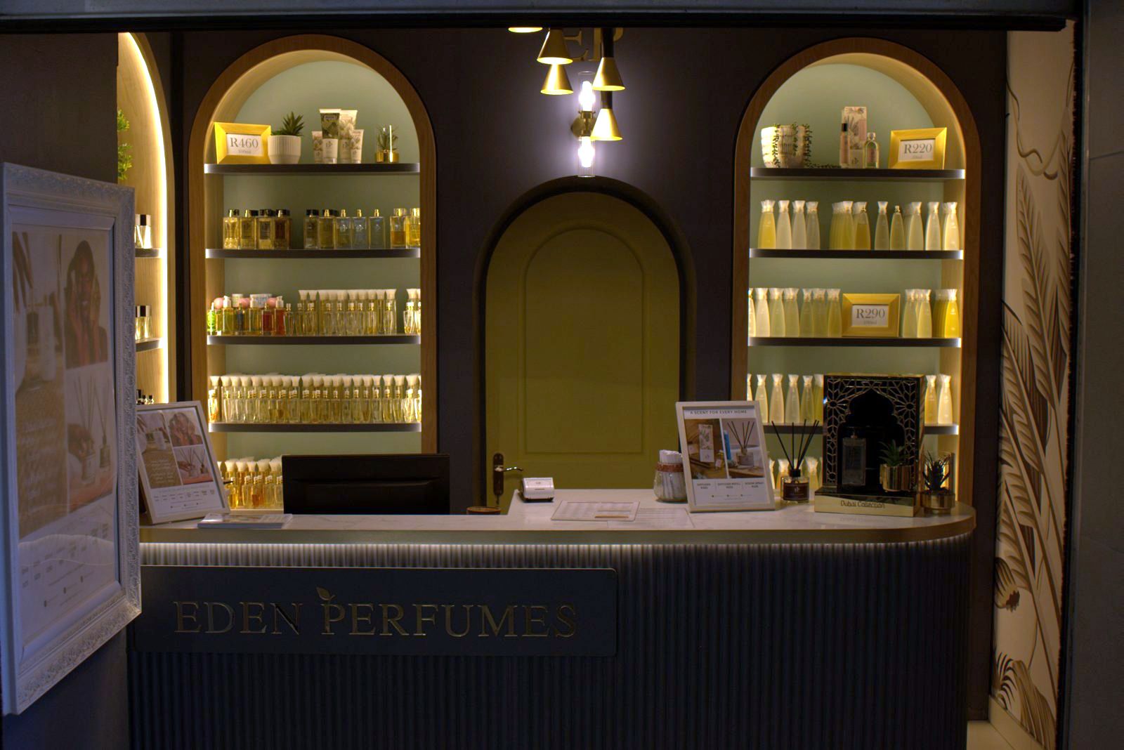 Eden Perfumes store with lit oak arches and a fluted counter