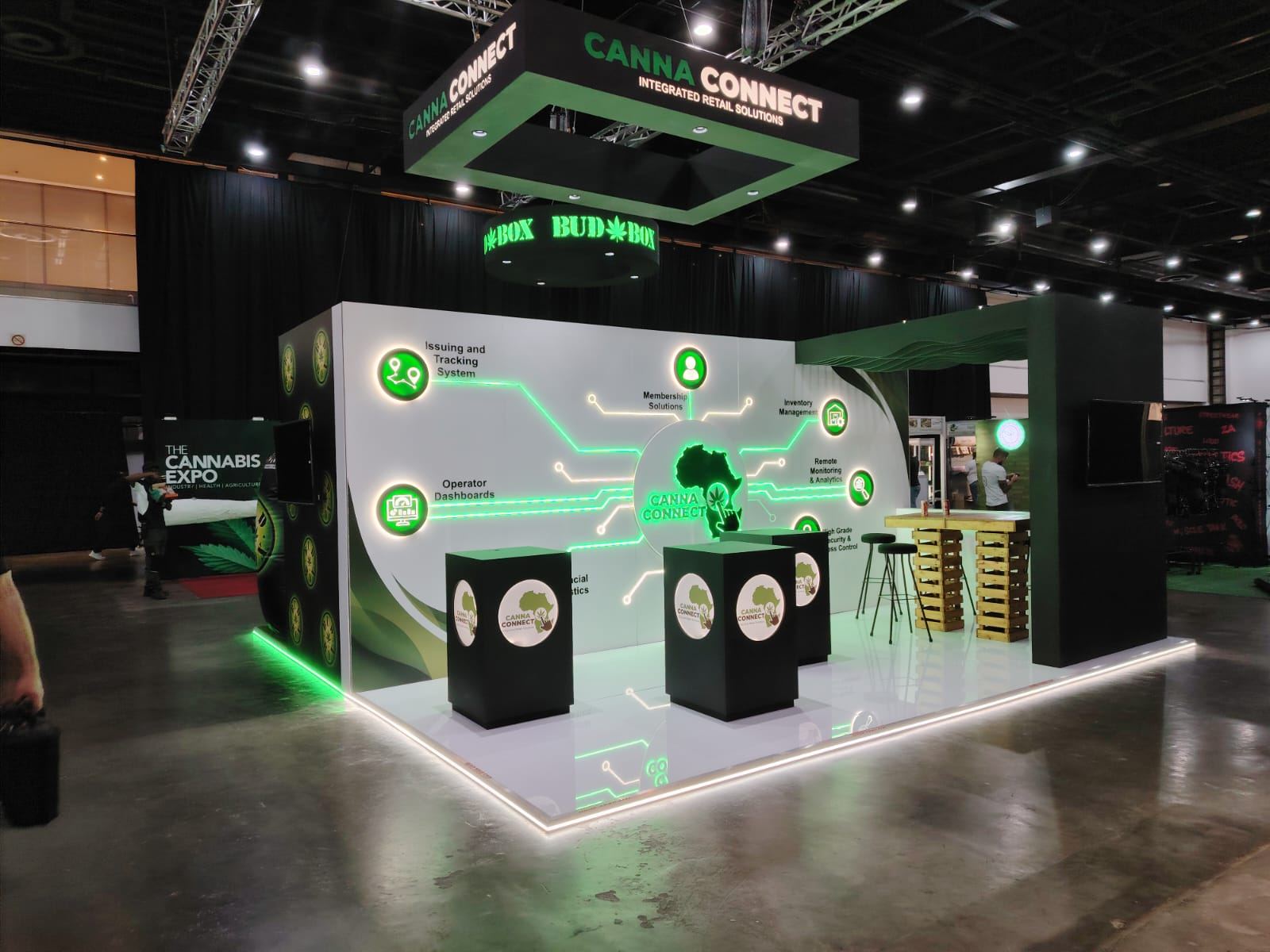 Canna Connect stand with a halo-lit circuit backwall under rigged light boxes